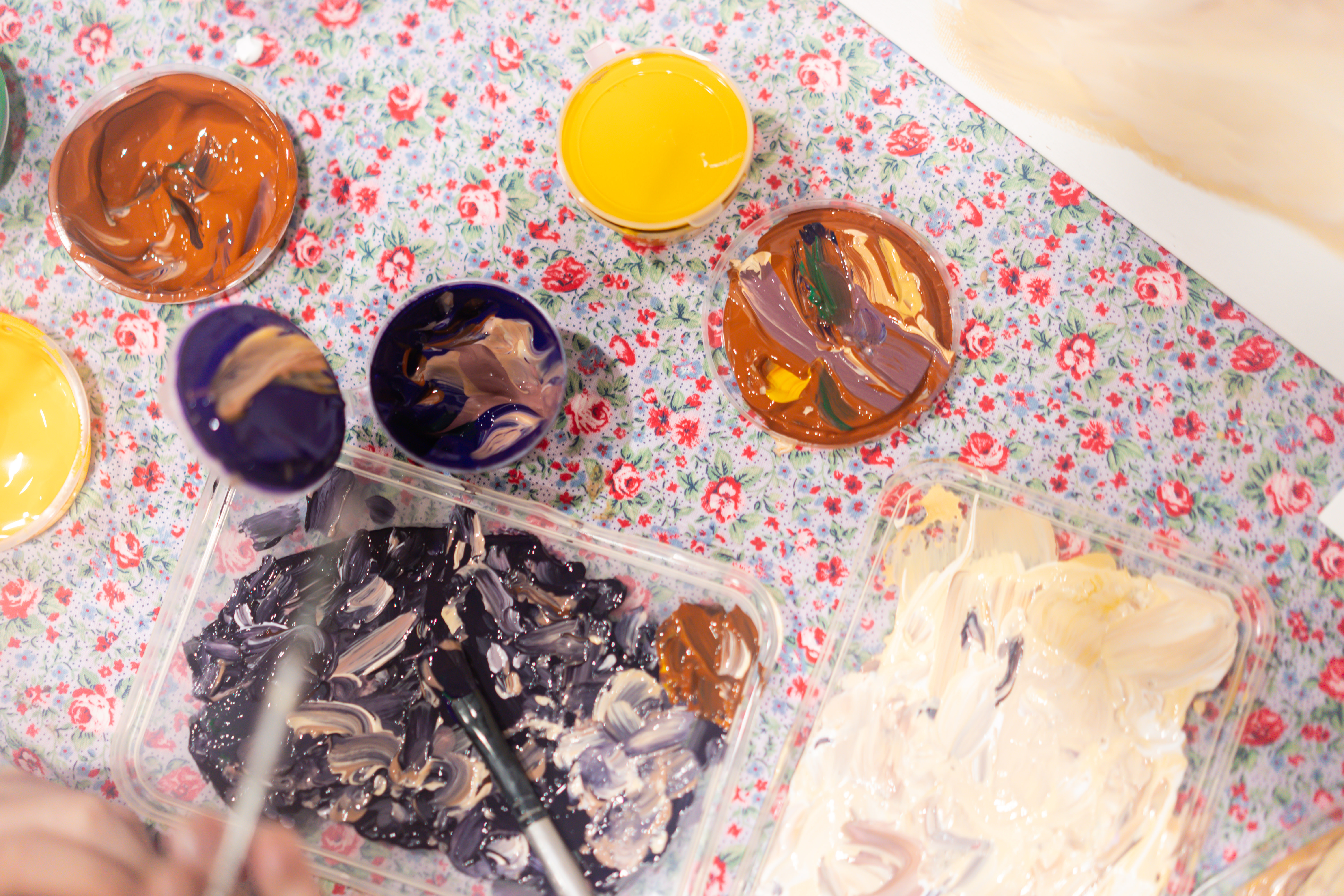 Paint pots on a table for a painting class